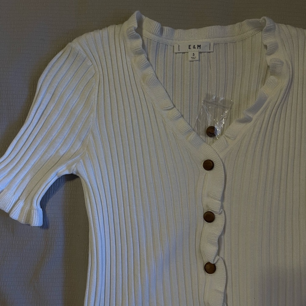 white top with wood buttons